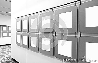 Art gallery mockup with blank paper posters hanging on the walls Stock Photo