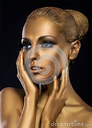 Gilt. Profile of Surprised Golden Woman's Face. Fantasy Stock Photo