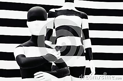 Art mannequin black and white stripes, on striped with black and white stripes. Disguise. Stock Photo