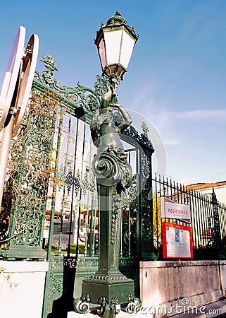 Art Nouveau street lamp and section of an iron fence, Vila Sauda, Lisbon, Portugal Editorial Stock Photo