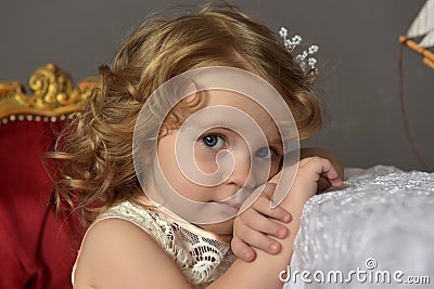Art portrait of a pretty little girl wearing princess dress Stock Photo