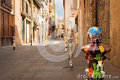 Art at the street - Guerrilla bollard art Stock Photo