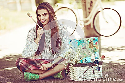 Art stylish hipster woman keep brush outdoor Stock Photo