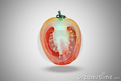 Art of tomato. a half of tomato, slice tomato, fly tomato isolated on dark vignette Stock Photo