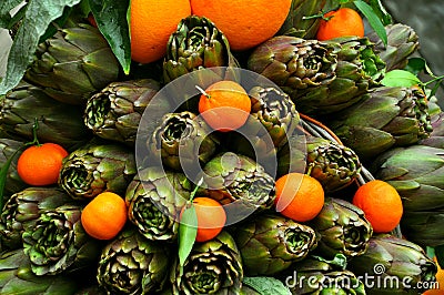 Artichokes and mandarines Stock Photo