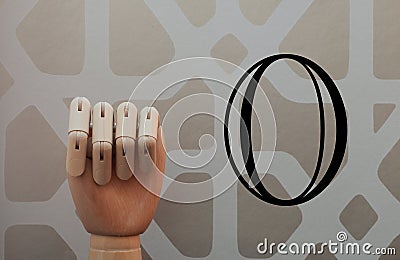 Articulated wooden hand with no raised finger in allusion to number zero Stock Photo