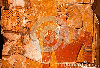 Artifact from ancient Egypt - relief of Pharaoh Seti I in front of the God Osiris Editorial Stock Photo