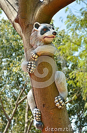Artifact of panda climbed on a tree in a garden Stock Photo