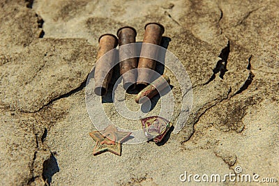 Artifacts and symbols of the times of the Soviet army - red star, Komsomol badge, guilty sleeves Stock Photo