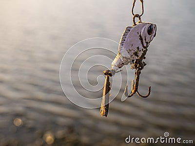 Artificial dam lake and artifisial fish with hook for fishing the shore bank. Stock Photo