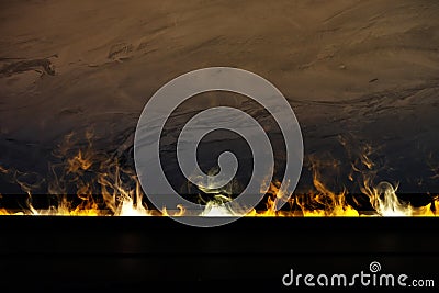 Artificial fire in the fireplace, close up Stock Photo