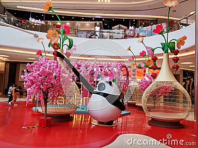 Artificial flowers decorate the landscape, in the mall lobby Editorial Stock Photo