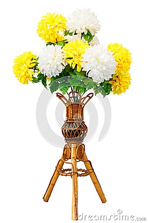 Artificial flowers and wicker wooden vase Stock Photo