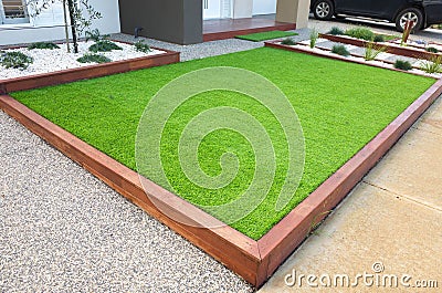 Artificial grass/lawn turf in the front yard of a modern home/residential house Stock Photo