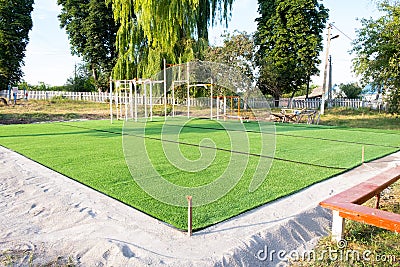 Artificial green grass on the playground. plastic lawn Stock Photo