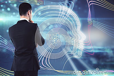 Artificial intelligence concept and machine learning concept with businessman looking at digital screen with hologram of human Stock Photo