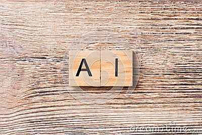 Artificial Intelligence word written on wood block. AI text on wooden table for your desing, concept Stock Photo