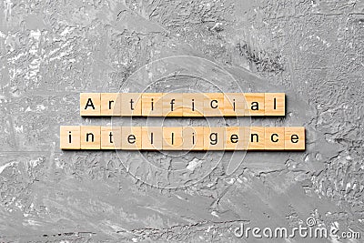 Artificial intelligence word written on wood block. Artificial intelligence text on cement table for your desing, concept Stock Photo