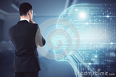 Artificial intellingence and machine learning concept with pensive businessman back looking at digital screen with human head Stock Photo