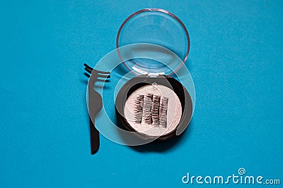 Artificial Magnetic False Eyelashes Set on blue background Stock Photo