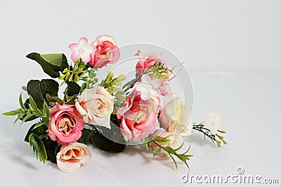 Artificial plastic flowers, plant for decoration, pink rose bouquet Stock Photo