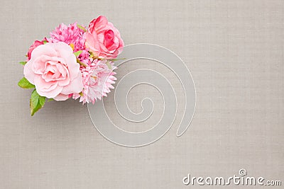 Artificial rose on the table cloth Stock Photo