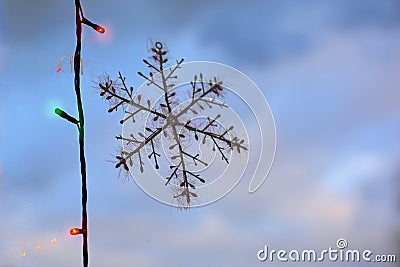 Artificial snowflake on the glass. Stock Photo