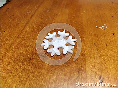 Artificial snowflake on the table Stock Photo