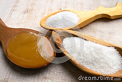 Artificial Sweeteners and Sugar Substitutes in wooden spoons. Na Stock Photo