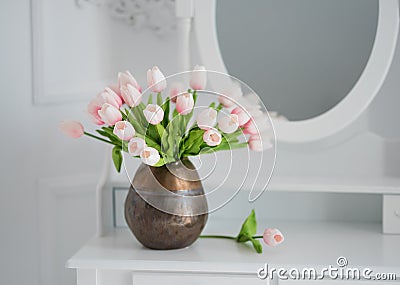 Artificial tulips on a table with a mirror Stock Photo