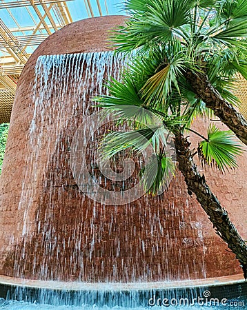 An artificial waterfall within the premises of the Terminal 2 of Kempegowda International Airport, Bangalore Editorial Stock Photo