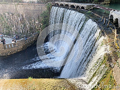 Artificial waterfall on the river Psyrtskha in the summer, the city of New Athos, Abkhazia Editorial Stock Photo