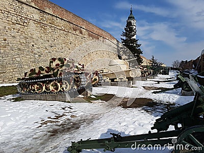 Artillery tank armour war machine park exhibition snow winter day sunshine serbia belgrade castle fortress metall tree Editorial Stock Photo