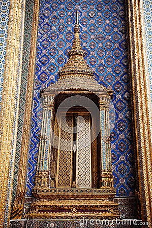Artisan ceramic facade and golden window of Bangkok Grand Palace Stock Photo