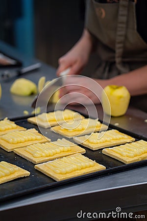 Artisan confectioner prepares homemade apple pie in a confectionery Stock Photo