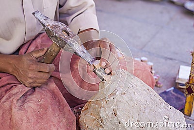 Artisan makes pieces for mosaic craftwork Stock Photo