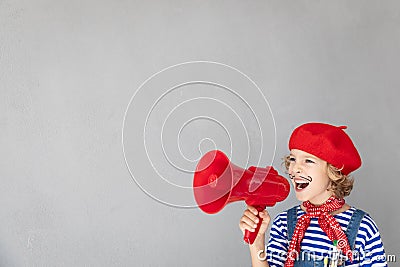 Artist child speaking by loudspeaker Stock Photo