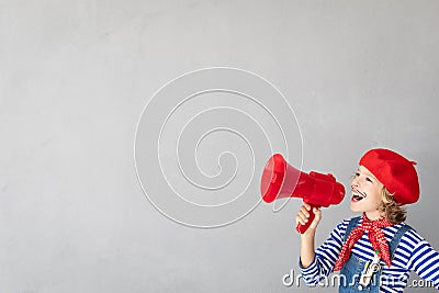 Artist child speaking by loudspeaker Stock Photo