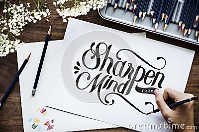 An artist creating hand lettering artwork Stock Photo