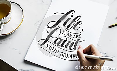 An artist creating hand lettering artwork Stock Photo