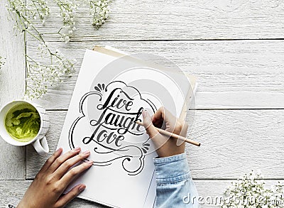 An artist creating hand lettering artwork from motivation quote Stock Photo