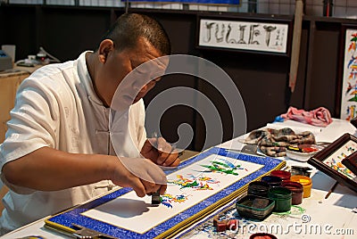 Artist drawing traditional art Editorial Stock Photo
