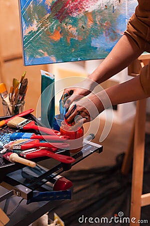 Artist hands with paint Stock Photo