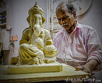 An artist making a sculpture of ganpati bappa indian god Editorial Stock Photo