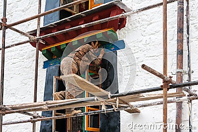 Artist paint decorating tibetan monastery in lhasa Stock Photo