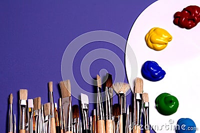 Artist Paint Palette with Paints and Brushes, Symbolic of Art Stock Photo