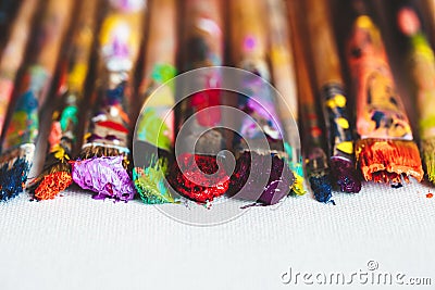 Artist paintbrushes closeup on artistic canvas. Stock Photo