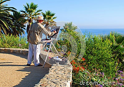 An artist painting in Heisler Park, Laguna Beach, CA Editorial Stock Photo