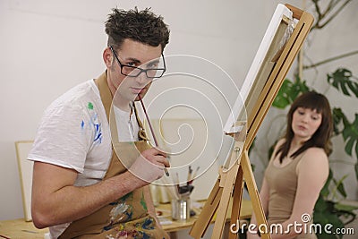 Artist painting model at art studio Stock Photo