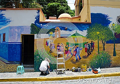 Artist painting outdoor mural Editorial Stock Photo
